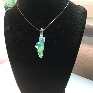 Artisan made Glass pendant.